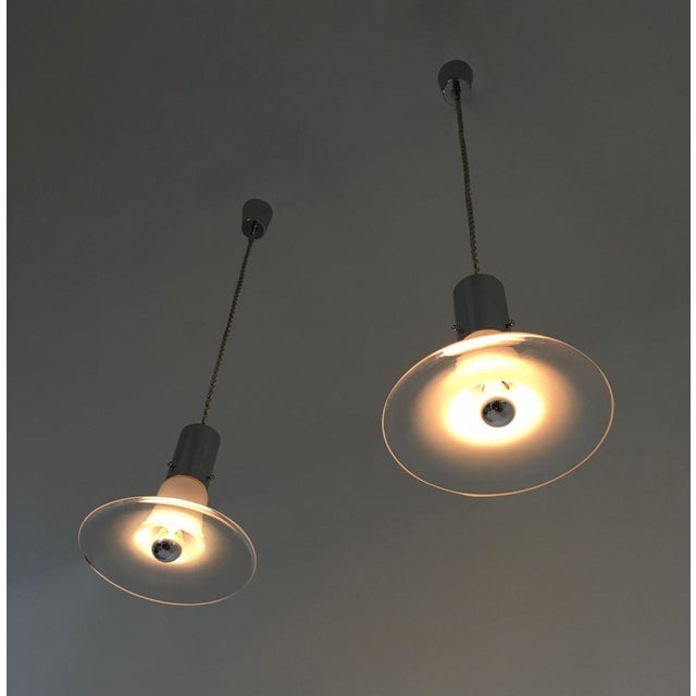 Made in Italy, 1960s. These pendants are made in chromed metal and Murano glass. It is a vintage set, therefore it might...