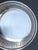 Shallow bowl by Reed and Barton marked 1942 and plated silver. The measurements are 6.25" in diameter and 1" deep.