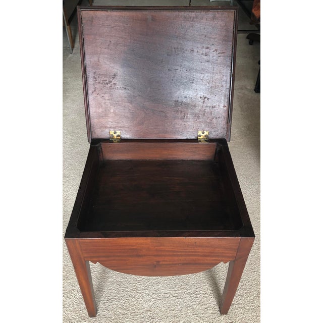 This beautiful antique English period Georgian Mahogany side table features a flip top that reveals storage inside. Made...
