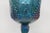 This wonderful iridescent blue goblet / cup is made of stunning carnival glass. It features the iconic Harvest Grape...