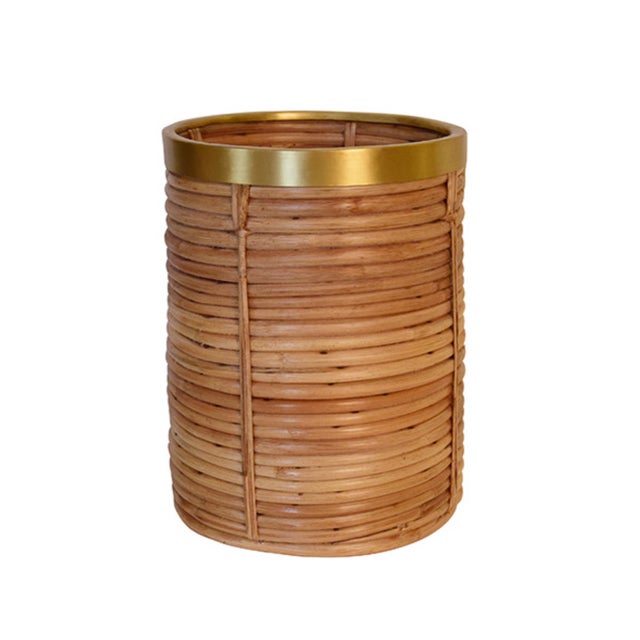 Keep your space tidy and stylish with our Brim Natural Rattan &amp; Brass waste basket. Made with natural rattan and...