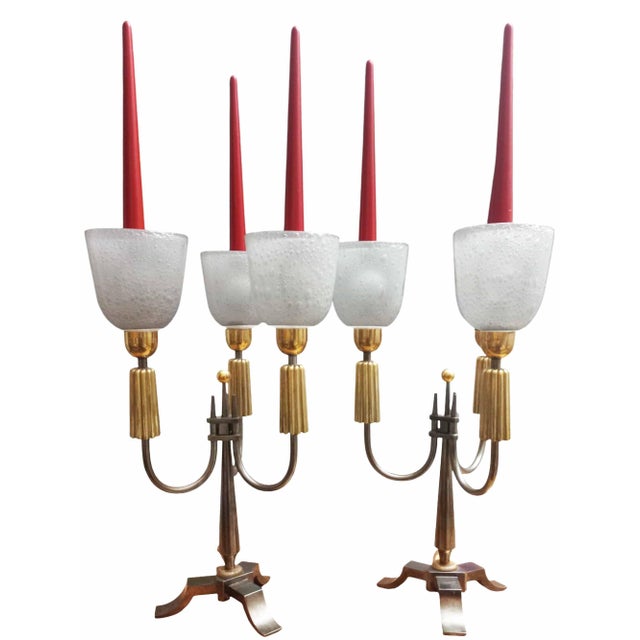 Important pair of brass candelabra with two patinas, gunmetal and gilt, each with three lights: white opaline glass and...
