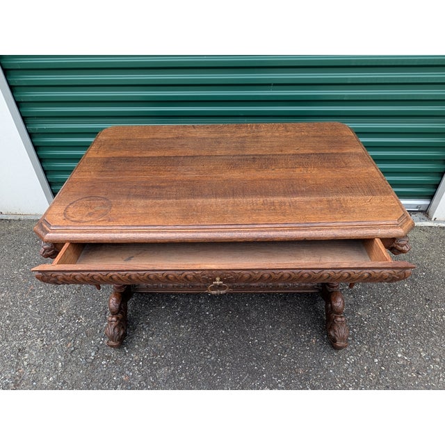 An absolute gem. Intricately carved, wonderfully rich oak table with bulbous legs, carved stretcher, hanging finials,...
