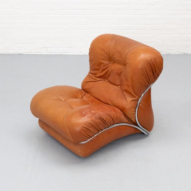 Corolla lounge armchair produced in the 1970s by i.p.e\. A distinctive design with wide, wing-like forms that give the...
