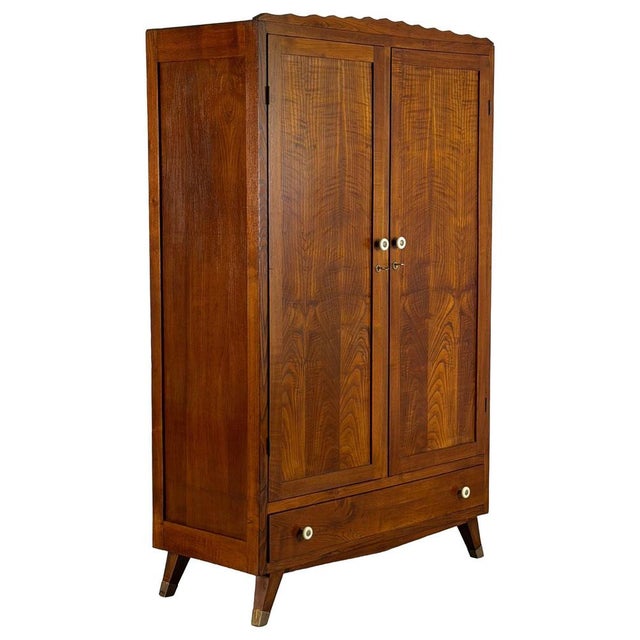 Elegant and exceptionally well-crafted wardrobe designed by Italo Gamberini and produced in Tuscany during the 1940s. This...