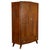 Elegant and exceptionally well-crafted wardrobe designed by Italo Gamberini and produced in Tuscany during the 1940s. This...