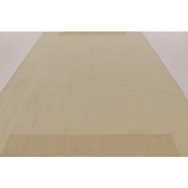 Handwoven in wool, this 9x11 contemporary Kilim is part of Rug & Kilim’s “Rez Kilim” collection, an exploration of...