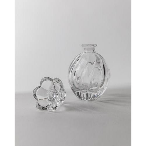 This vintage Murano glass perfume bottle from 1950s Italy is a refined example of hand-blown Venetian glass artistry....