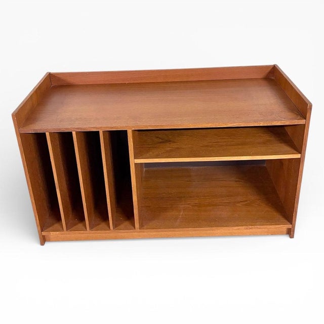 The Danish teak media unit offers a perfect blend of style and function, designed to enhance your living space while...