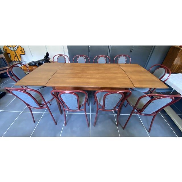 Beautiful extendable teak dining table By Johannes Andersen for Samcom, Denmark, 1960 This table features an integrated...