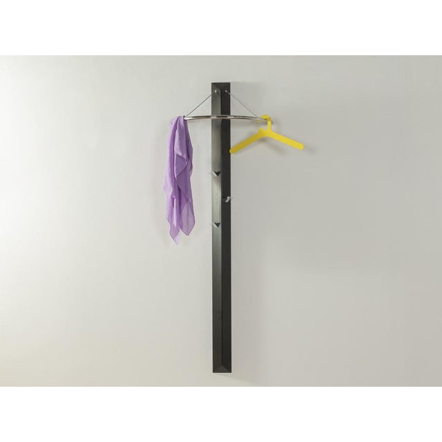 Postmodern wardrobe by Schönbuch from the 1980s. Frame made of black painted wood with a hanging rail and three metal...