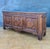 Spanish Renaissance Revival oak sideboard, 1930s Crafted in solid oak, this substantial piece features carved geometric...
