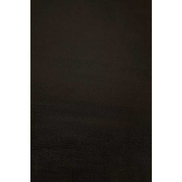 Contemporary, edgy, and quite simply exceptional, this dining table is handcrafted of pale with light brown trim finished...