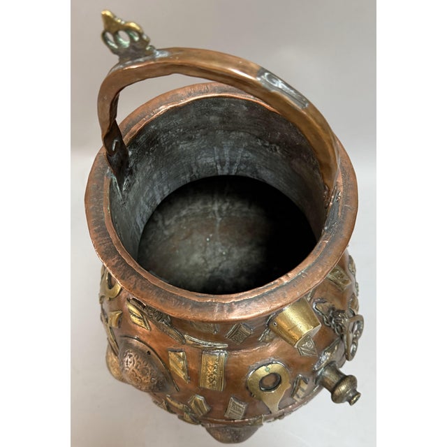 Add a bold, exotic touch to your space with this eye-catching 19th-century Tibetan vessel! Handcrafted from hammered...
