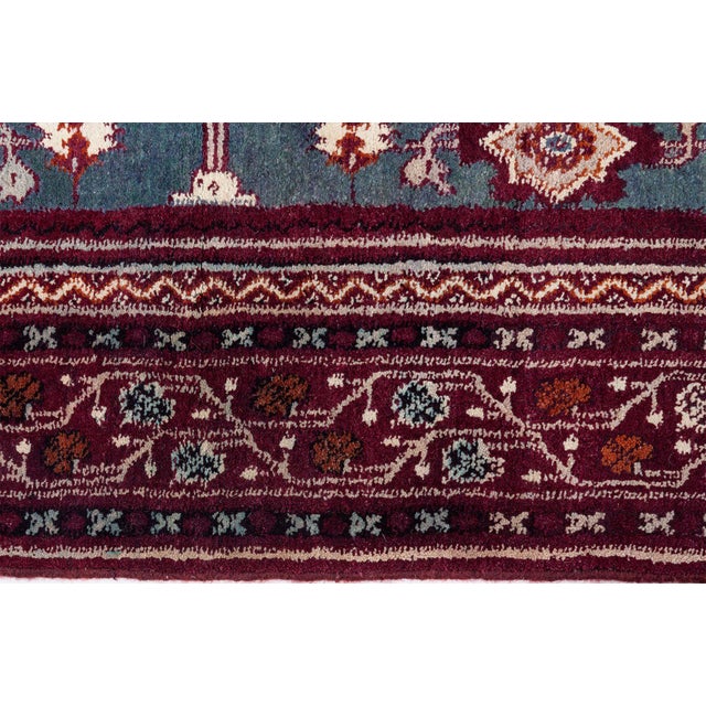 This striking square-format antique Amritsar rug from India exemplifies the luxurious artistry of North Indian weaving...