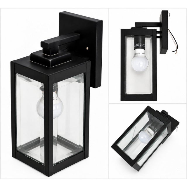 A sleek Quoizel outdoor wall lantern with clean lines, a rectangular black frame, and clear glass panels. The minimalist...