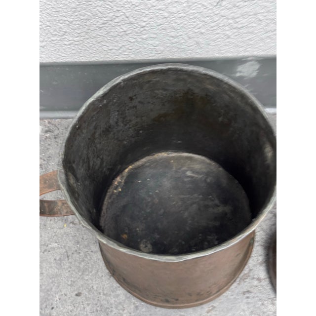 Design Plus Gallery presents a Set of Three Antique 19th Century Vessels. Each bearing a rich natural patina earned...