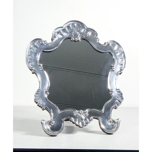 Louis xv style table mirror with 925 silver foil decoration. Codevilla. Origin genoa period early twentieth century...