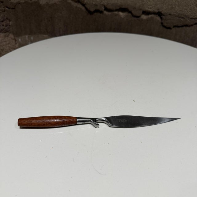 For your consideration, a vintage bar knife bottle opener by Dansk, Design by Jens Quistgaard. Stainless steel and teak...