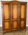 A superb Vintage French Louis wardrobe crafted in oak, featuring an elegant triple-door design with beautifully shaped...