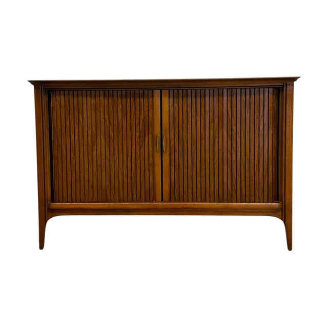 Bring iconic mid-century design and functional elegance into your home with this stunning vintage walnut credenza. Crafted...