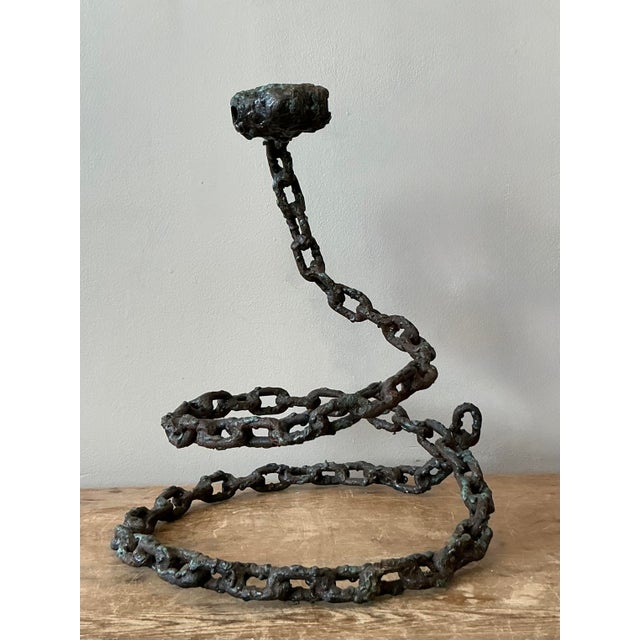 Inject a dose of raw, industrial edge into your decor with this striking vintage Brutalist snake sculpture. Hand-crafted...