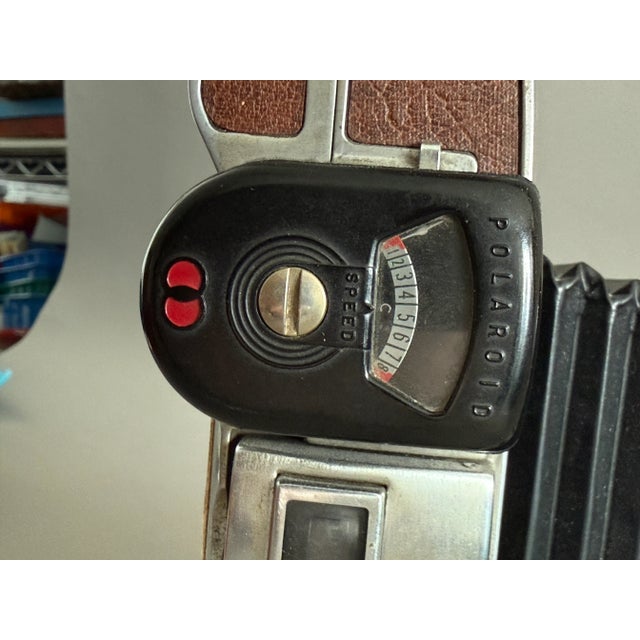 This Polaroid Model 95 Land Camera with Meter is a truly rare find. This iconic camera, the model that introduced instant...