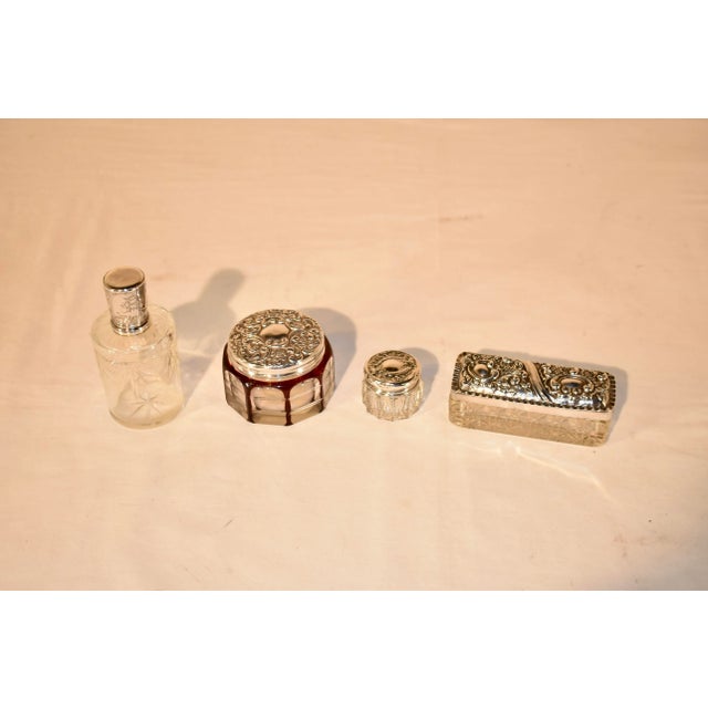 4 piece cut crystal dresser set. The bottle measures 2 x 4.25, and has a lovely lid which has an inscription 30 April...