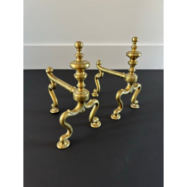 Antique whimsical English brass andirons that will enliven your fireplace or your decor. The pair is on the smaller side...