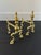 Antique whimsical English brass andirons that will enliven your fireplace or your decor. The pair is on the smaller side...