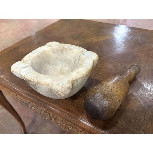 Substantial in weight and beautifully timeworn, this antique mortar and pestle set was crafted in France circa 1880. Hand-...
