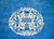 A wonderful late 19th century Chinese Peking rug with a round peony, chrysanthemum, and cherry blossom medallion set...