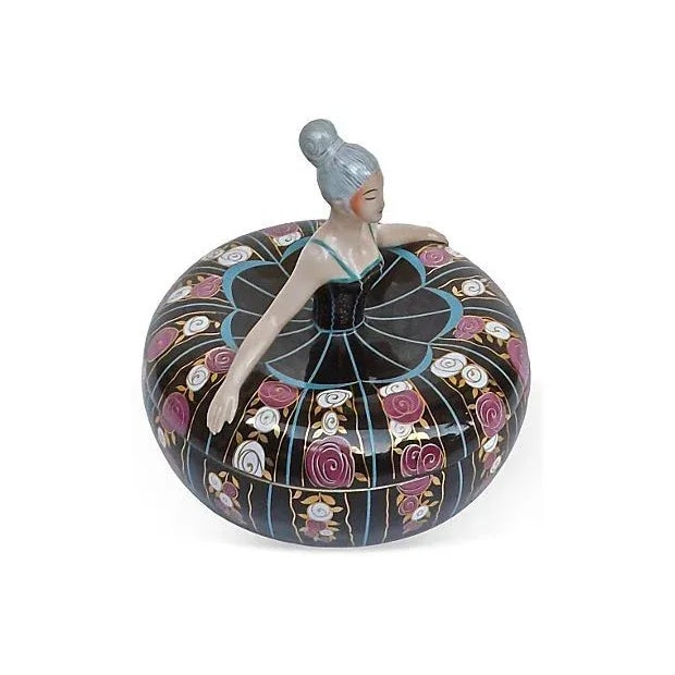 This porcelain ballerina lidded bonbonniere box features a French, Art Deco style ballerina head and torso as the handle...