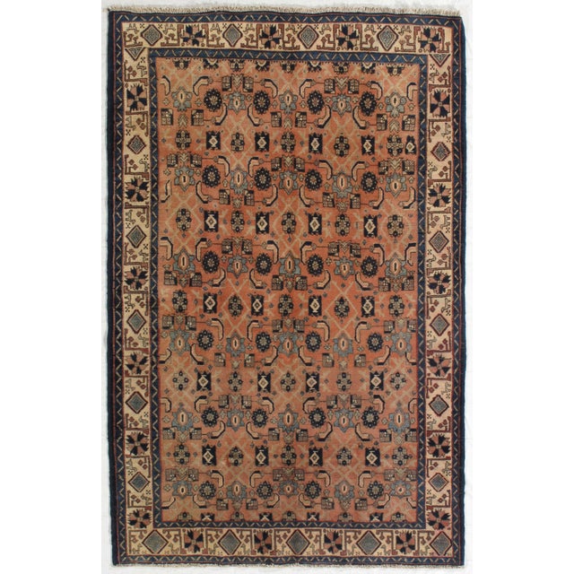 Vintage hand-knotted Persian Bakhtiari wool rug with a warm terracotta field featuring an allover geometric and floral...
