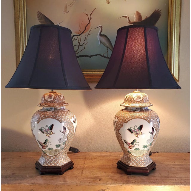 Early 20th Century Pair of Chinese Porcelain Lamps With Butterflies on Hexagon Carved Wood Bases For Sale - Image 4 of 12