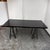 Design Plus Gallery presents a Contemporary Saw Horse Bases Table. The rectangular wood veneer top has a smooth surface...