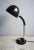 This black desk lamp with impeccable chrome elements is from the 1970s. Due to the flexible gooseneck adjustable lighting...