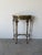 An elegant and highly decorative 1920s Oscar Bach-style console table with matching mirror, showcasing exceptional...