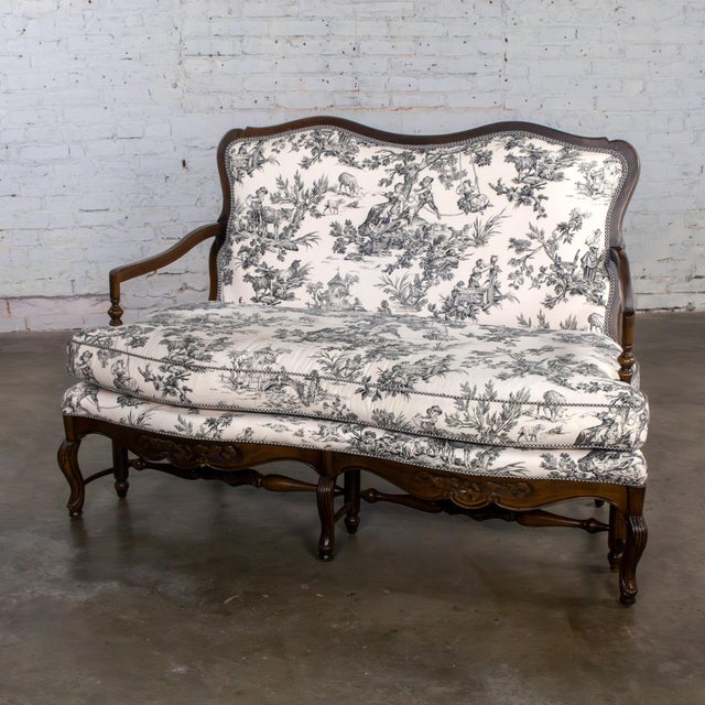 Gorgeous vintage French Louis XV style settee or loveseat by Highland House Furniture composed of a dark carved wood frame...