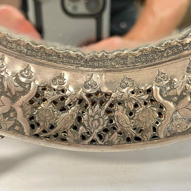 Vintage Persian table top vanity mirror crafted from .840 silver with teardrop shape and fine chased and repousse designs...