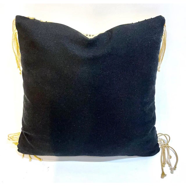 Vintage black and beige geometric needlepoint African design pillow with tasseled corners. Black fabric backside. No...