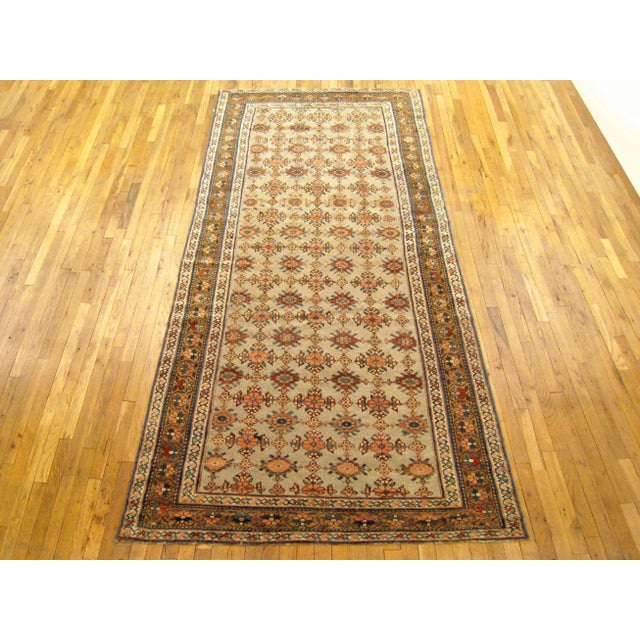 Antique Persian Kurd rug, Gallery size, circa 1920 A one-of-a-kind vintage Persian Kurd Oriental Carpet, hand-knotted with...