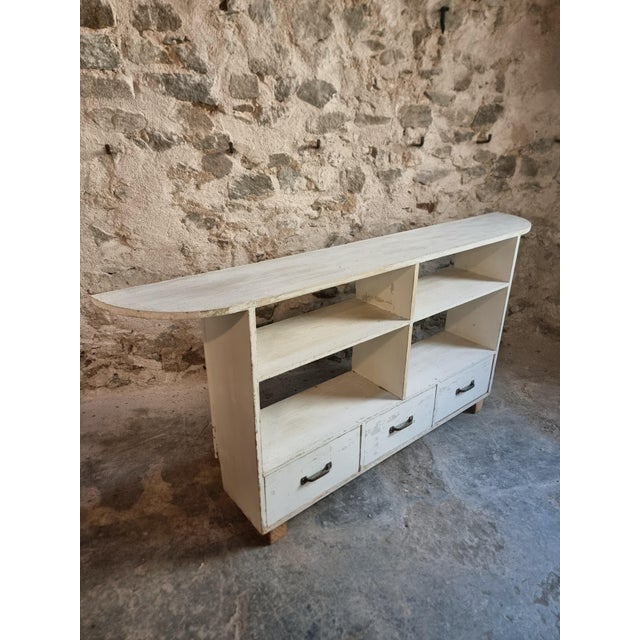 French pine storage unit dating from the 1960s. Originally used as a functional display or storage cabinet, featuring six...