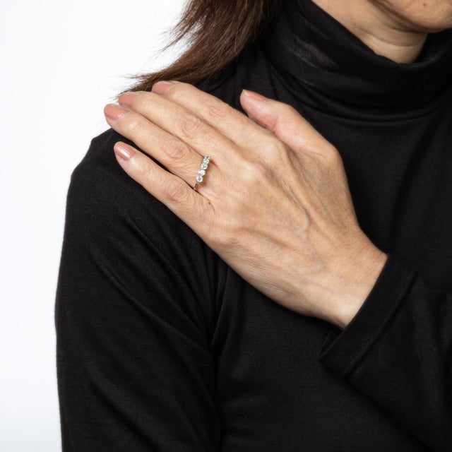 Stylish Edwardian style 5 stone diamond ring crafted in 900 platinum. 5 old European cut diamonds total an estimated 0.70...