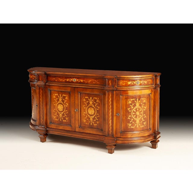 A refined showcase of traditional Italian artistry, this exquisite sideboard features a gracefully curved profile...