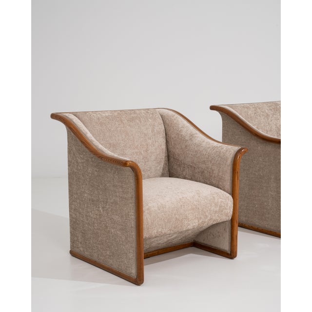 A coordinated pair of armchairs inspired by Art Deco design, featuring clean geometry and structured silhouettes. The...