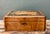 This vintage wood writing desk box showcases intricate inlay work, with floral and geometric marquetry set against a rich,...