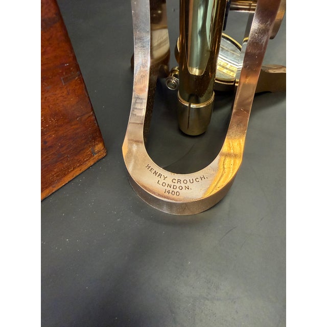 A remarkable 19th-century English brass binocular microscope by renowned scientific instrument maker Henry Crouch of...