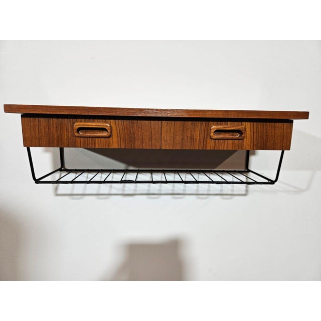 Console with a shelf made of teak, 1960s. The furniture has two practical drawers and a lower shelf with a metal frame....