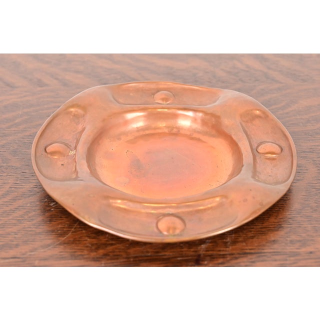 A gorgeous antique Arts & Crafts period hand hammered copper ashtray or catchall By Gustav Stickley (signed to the...